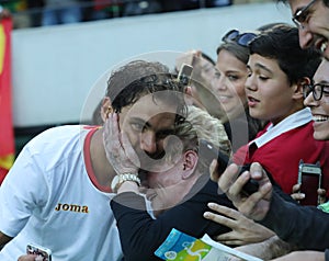 Olympic champion Rafael Nadal of Spain with tennis fan after men`s singles semifinal of the Rio 2016 Olympic Games