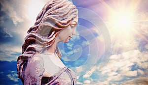 Olympic goddess of love and beauty in antique mythology Aphrodite Venus. Ancient statue against dramatic view of sky photo