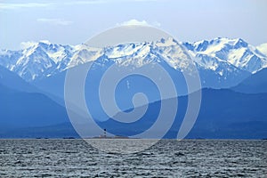 Olympic National Park, Race Rocks Lighthouse in Juan de Fuca Strait and Snowy Olympic Mountains, Washington State, USA