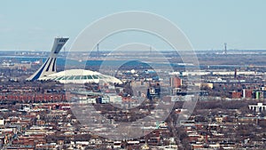 Olympic Stadium Stade Olympique protruding the Montreal skyline on a cold winter day.