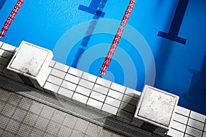 Olympic swimming pool starting platform no people photo