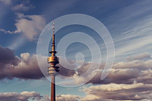 Olympic tower or TV Tower telecommunications with clouds in Munich Bayern, Germany