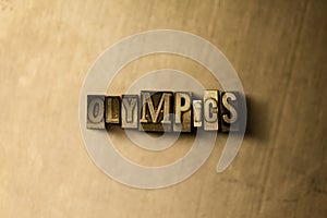 OLYMPICS - close-up of grungy vintage typeset word on metal backdrop