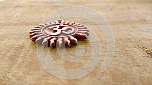 Om pendent on wood background and greeting