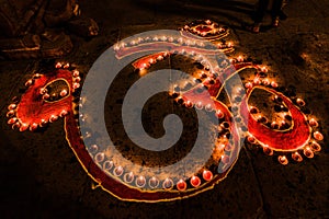 Om Spiritual Sign Illuminated With Candles