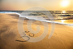 Om symbol on the beach