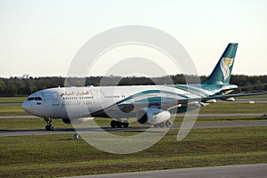 Oman Air taxiing on runway