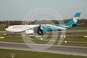 Oman Air taxiing on runway