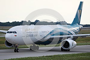 Oman Air taxiing on runway