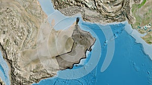 Oman border shape overlay. Bevelled. Satellite.