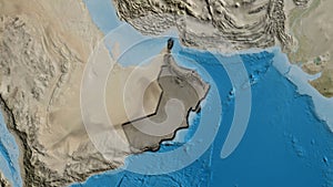 Oman border shape overlay. Bevelled. Satellite.