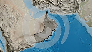 Oman border shape overlay. Bevelled. Satellite.