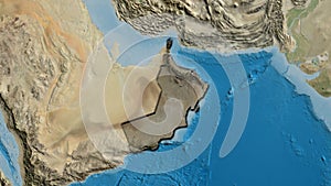 Oman border shape overlay. Bevelled. Satellite.