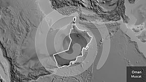 Oman border shape overlay. Glowed. Grayscale. Labels