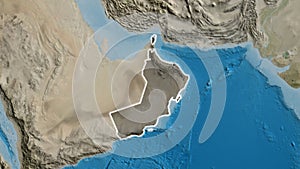 Oman border shape overlay. Glowed. Satellite.