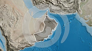 Oman border shape overlay. Glowed. Satellite.