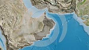 Oman border shape overlay. Outlined. Satellite.