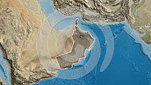 Oman border shape overlay. Outlined. Satellite.