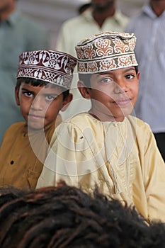 Oman boys with traditional clothing