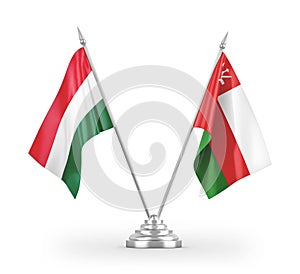 Oman and Hungary table flags isolated on white 3D rendering