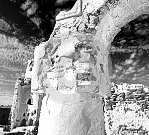 in oman the old abandoned village arch house and cloudy sky