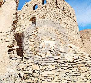 in oman the old abandoned village house and cloudy sky