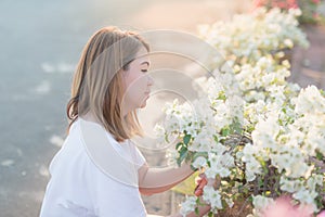 Oman pruning flowers and plants