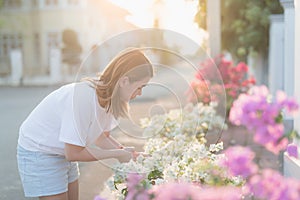 Oman pruning flowers and plants