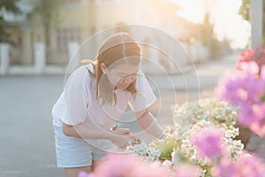 Oman pruning flowers and plants