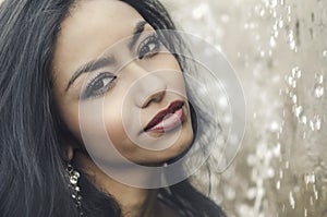 Oman's face pictured by falling water droplets