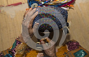 Omaniya making a bracelet