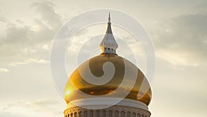 Omar Ali Saifuddien Mosque during sunset with reflection in the calm pond water in Bandar Seri Begawan, Brunei.