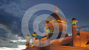 Omar Ali Saifuddien Mosque during sunset with reflection in the calm pond water in Bandar Seri Begawan, Brunei.