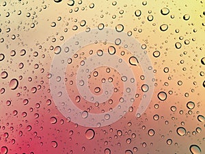 OmbrÃÂ© sunset with raindrops background