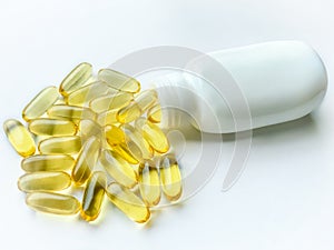 Omega-3 capsules with the bottle on white background. Polyunsaturated fatty acids. The concept of a healthy lifestyle