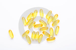 Omega 3 capsules on white background Fish oil Yellow softgels Vitamin D, E, A supplement Concept of healthcare