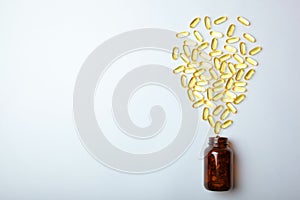 Omega 3 capsules on a white background with place for text.