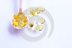 Omega 3 fish liver oil capsules on white background