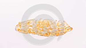 Omega 3 yellow soft gel pills isolated on white background.