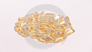 Omega 3 yellow soft gel pills isolated on white background.