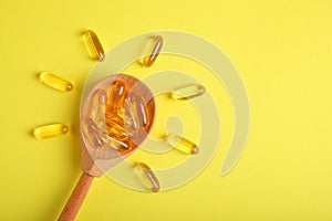 Omega 3 capsules on a colored background close-up with place for text. photo
