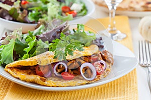 Omelet filled with chanterelle mushrooms photo