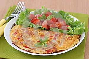 Omelet with ham and salad