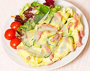 Omelet with ham and zucchini