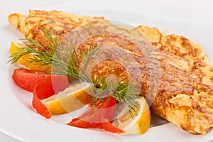 Omelet with herbs, tomatoes and lemon