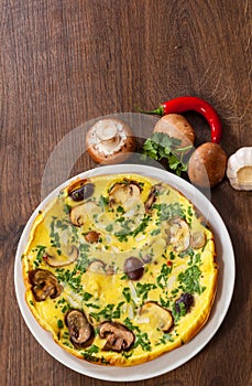 Omelet with mushrooms in a plate