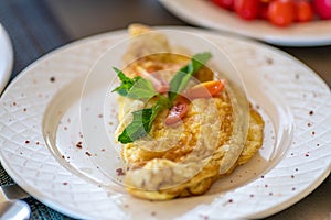 Omelet ready for breakfast on a plate