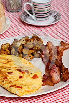 Omelet with red peppers bacon and home fries