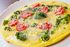 Omelet with tomato, broccoli and cheese