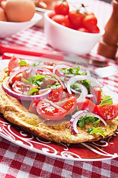 Omelet with tomato salad